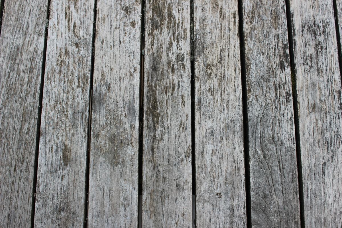 Wooden deck boards with visible gaps