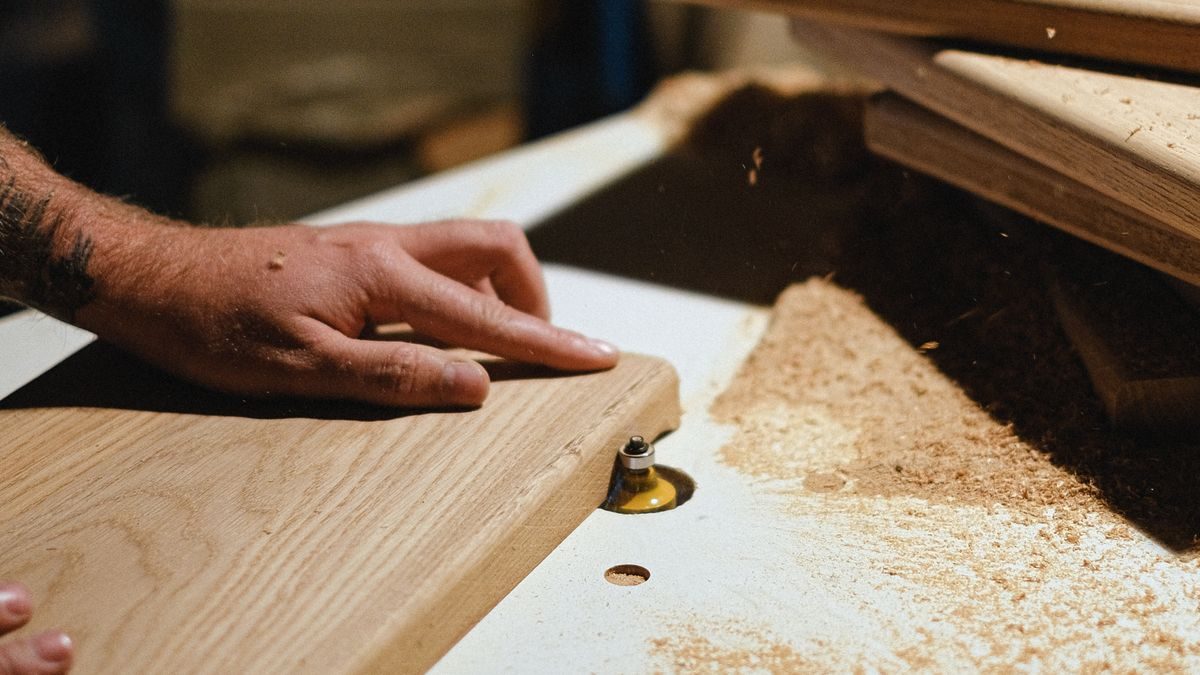 Carpenter working a wood plank