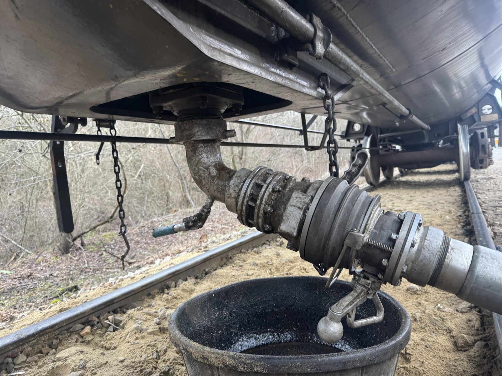 A loading arm connected to a railcar during a custody transfer
